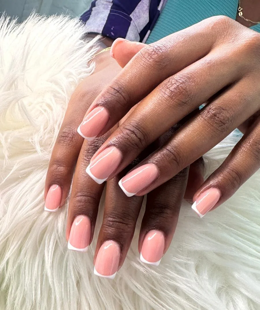 Acrylic nails with butterfly nail art detail at Glit Nails Accra Ghana