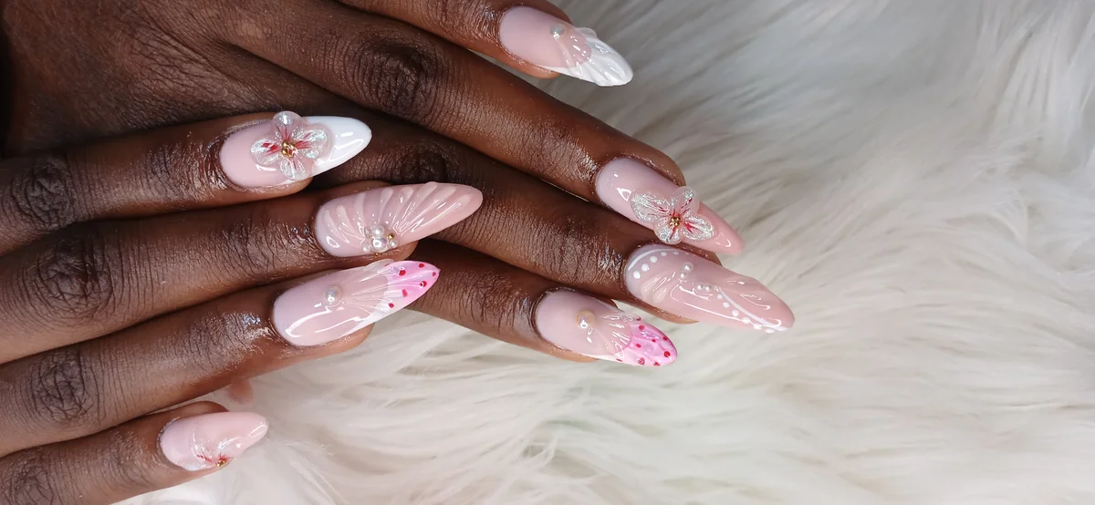 Gel X extensions with nude and glitter accent at Glit Nails Ghana